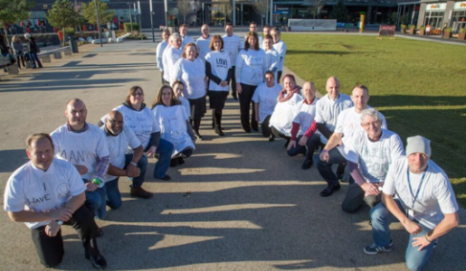 Human White Ribbon formed against domestic abuse